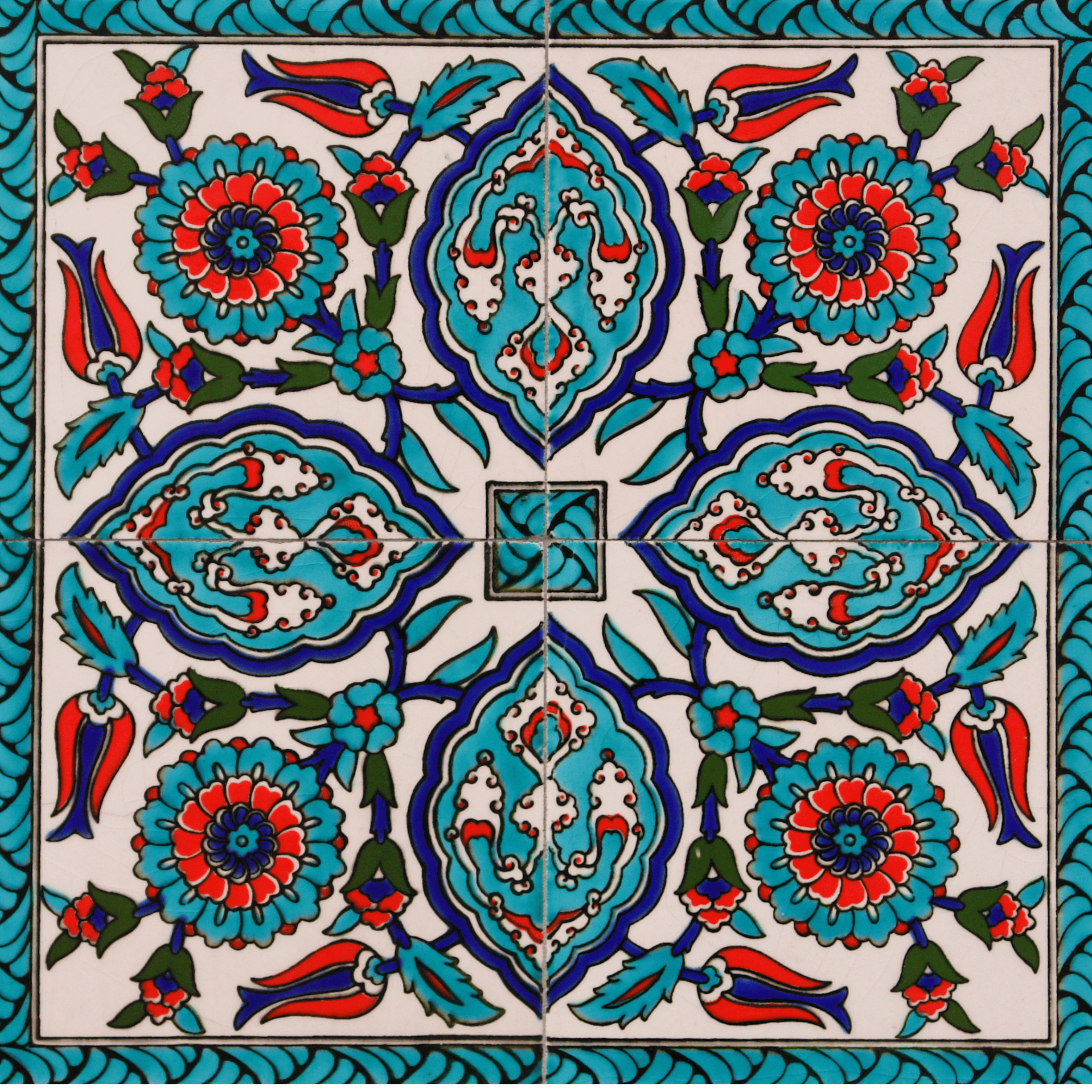 Four-tile Iznik panel with turquoise medallion and saz leaf motifs